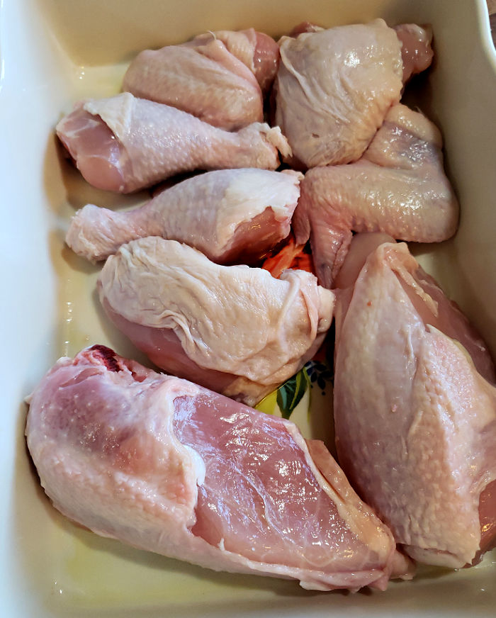 Raw chicken for classic Southern baked chicken recipe in rectangle dish
