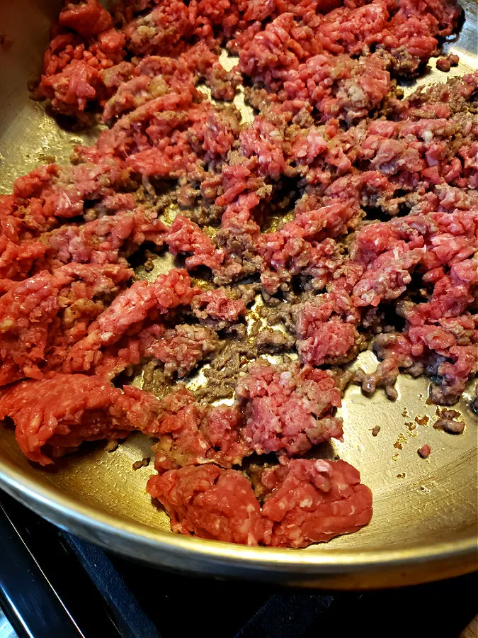 ground beef in a skillet browning