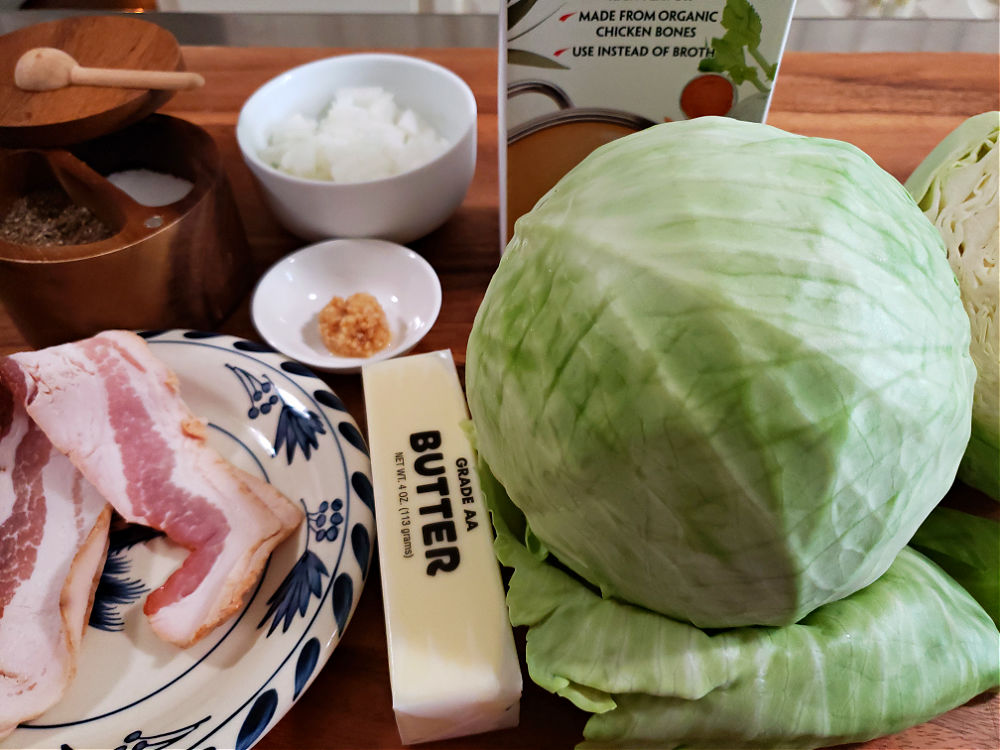 Ingredients for making Southern boiled cabbage arranged on a cutting board