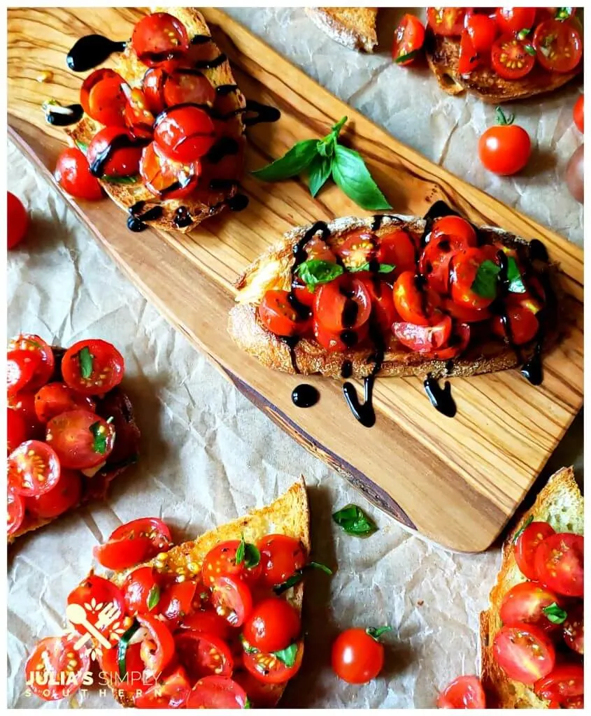 Toasted Italian bread pieces with marinated tomato topping in bruschetta recipe