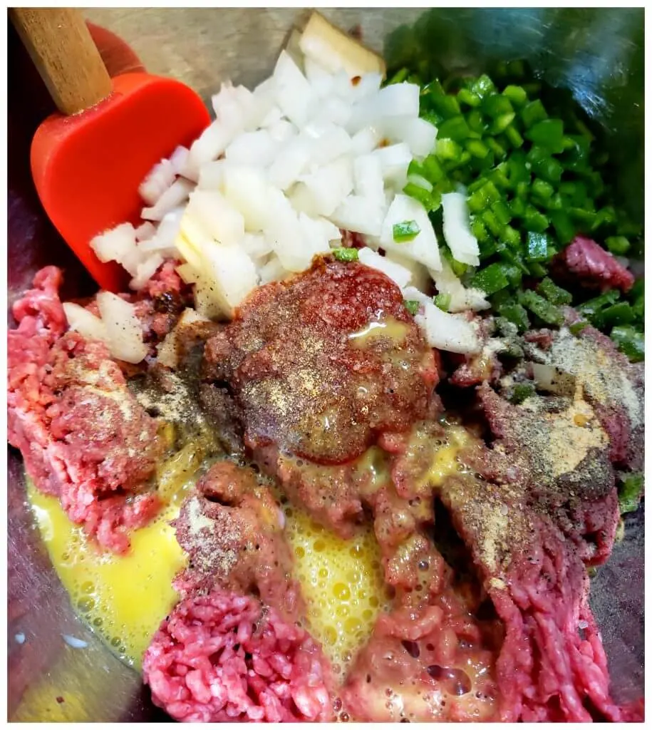 Ingredients to prepare a meatloaf in a mixing bowl