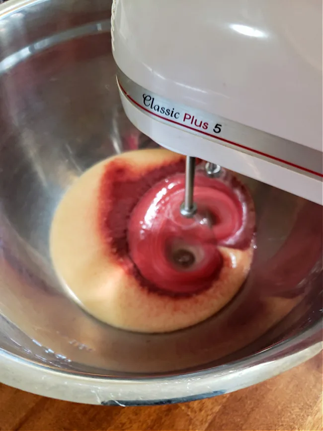 Mixing Kool aid with sweetened condensed milk using a hand mixer