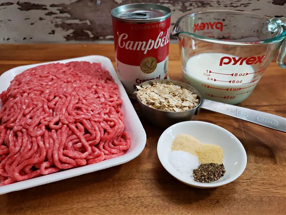 cutting board with ingredients to prepare old fashioned meatballs and gravy recipe