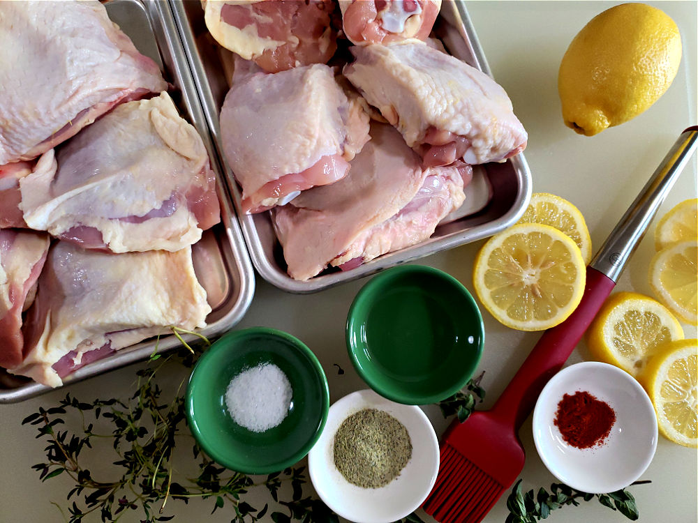 recipe for baked chicken thighs assembly of ingredients needed on a cutting board