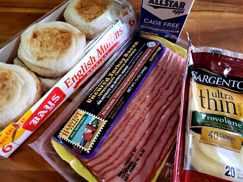 Ingredients for breakfast sandwiches on English muffins with turkey bacon and egg whites