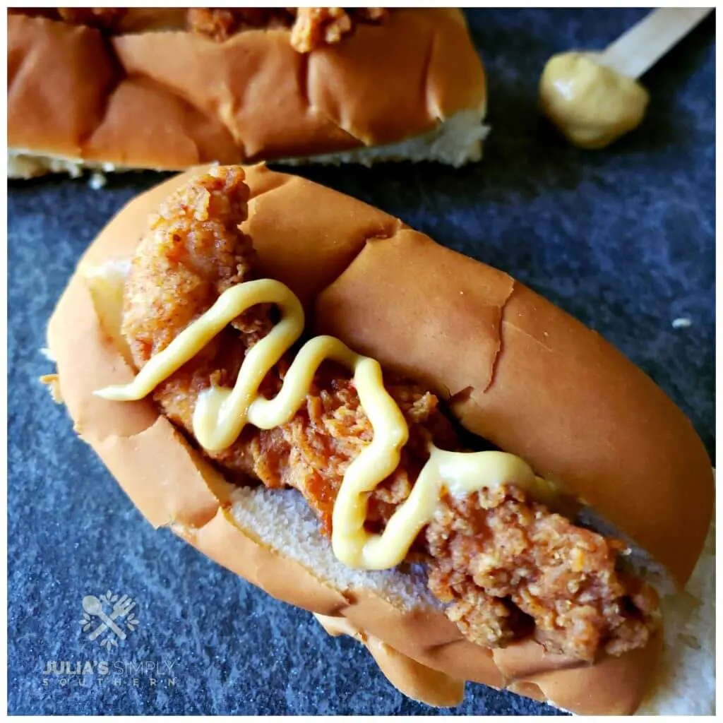 Upstate SC Bird Dog Recipe is a fried chicken tender sandwich on a hot dog bun topped any way you like it.