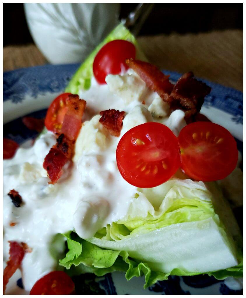 Classic Wedge Salad with Blue Cheese Dressing, cherry tomatoes and crumbled bacon