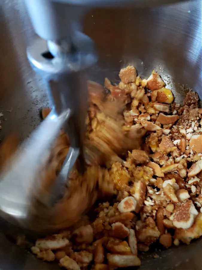 Mixing orange snowballs dough in stand mixer