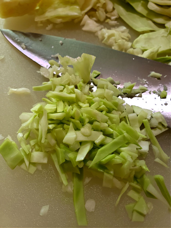 hand chopping cabbage