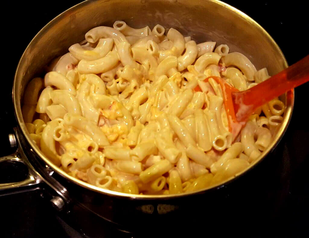 pot on a stove top with cheesy pasta