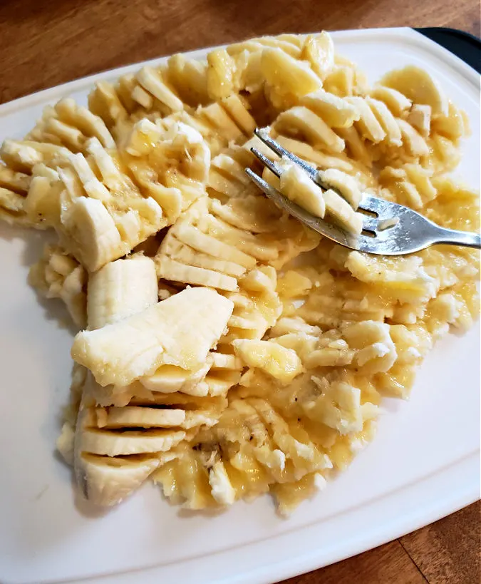 Mashed bananas on a cutting board