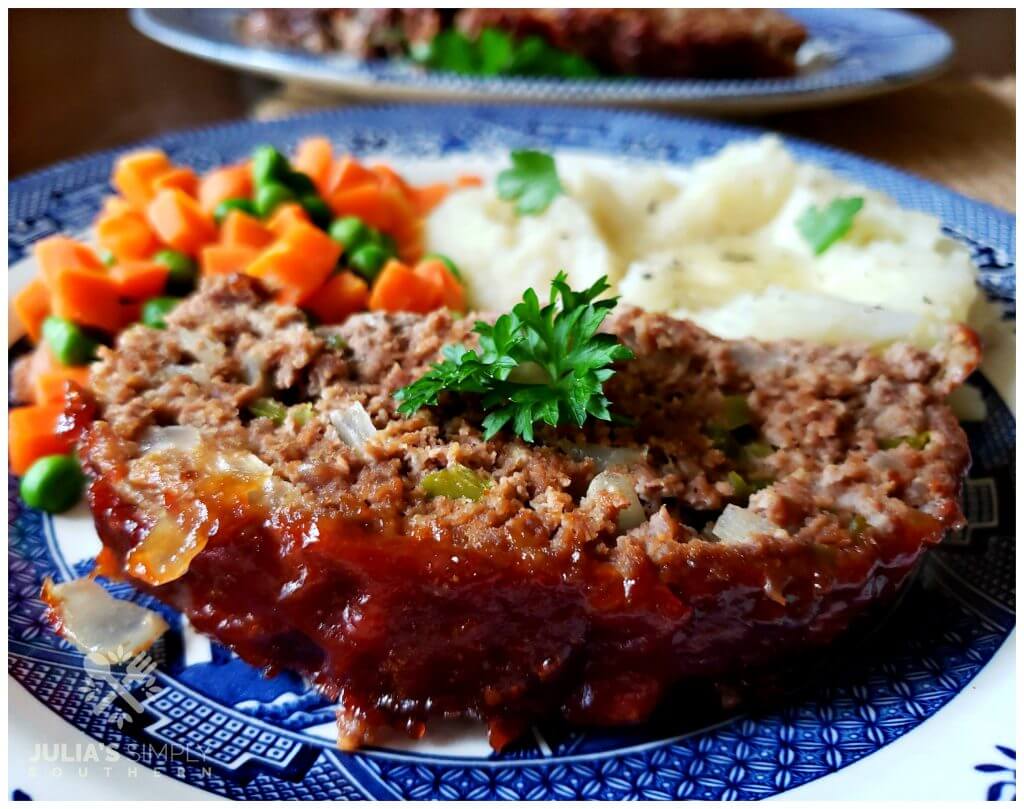 Delicious meatloaf dinner served with two sides on a plate