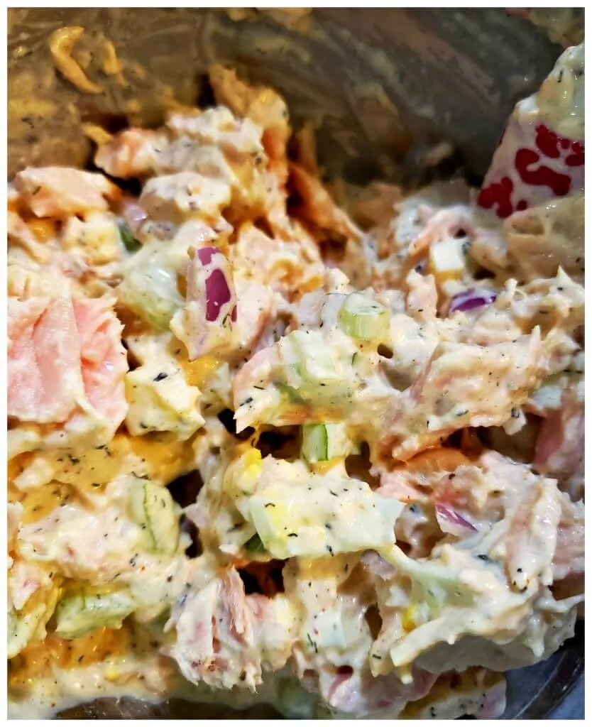 Creamy tuna salad mixture in a mixing bowl