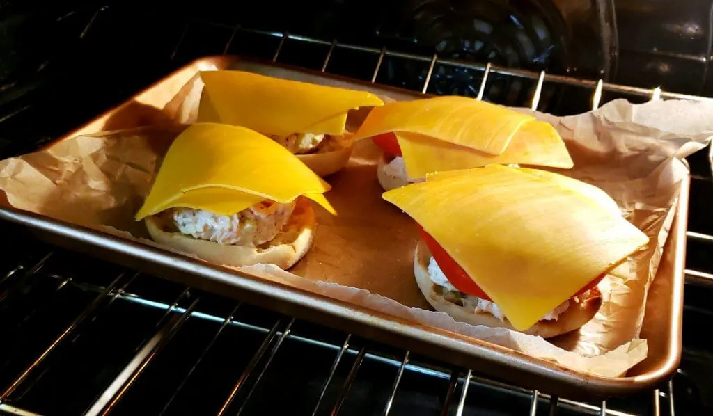 Tuna Melts on a baking sheet in the oven for toasting 