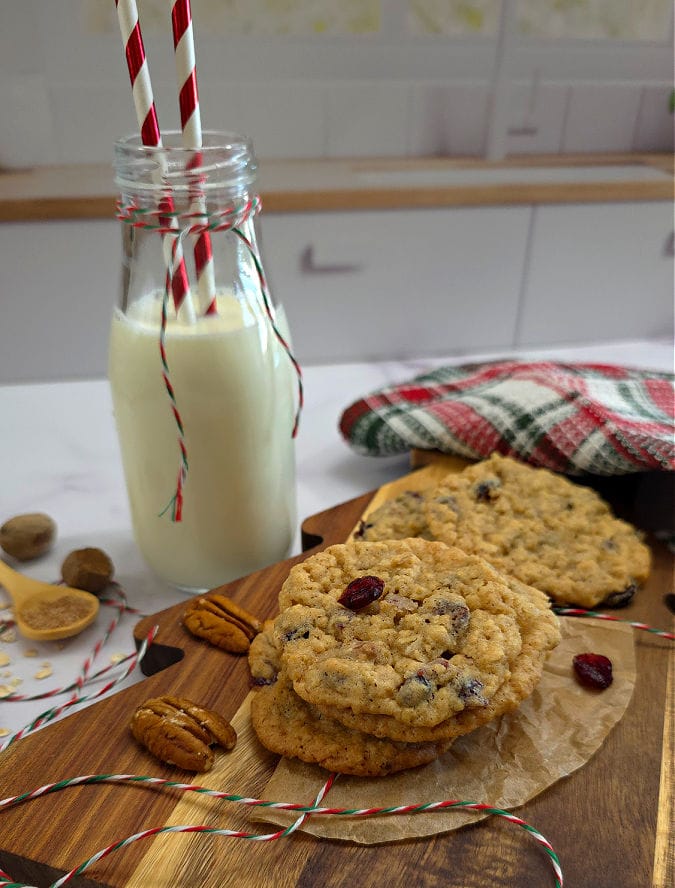 Home baked oatmeal cranberry pecan cookies served with milk