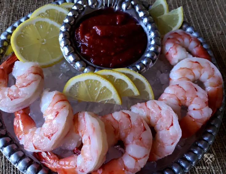 Classic Shrimp Cocktail Sauce Recipe - served on a bed of crushed ice and lemon slices - easy appetizer