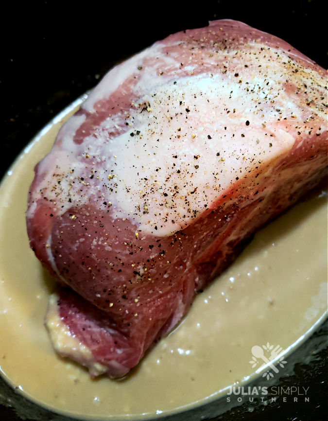 slow cooking a pork roast in a Crock Pot with gravy