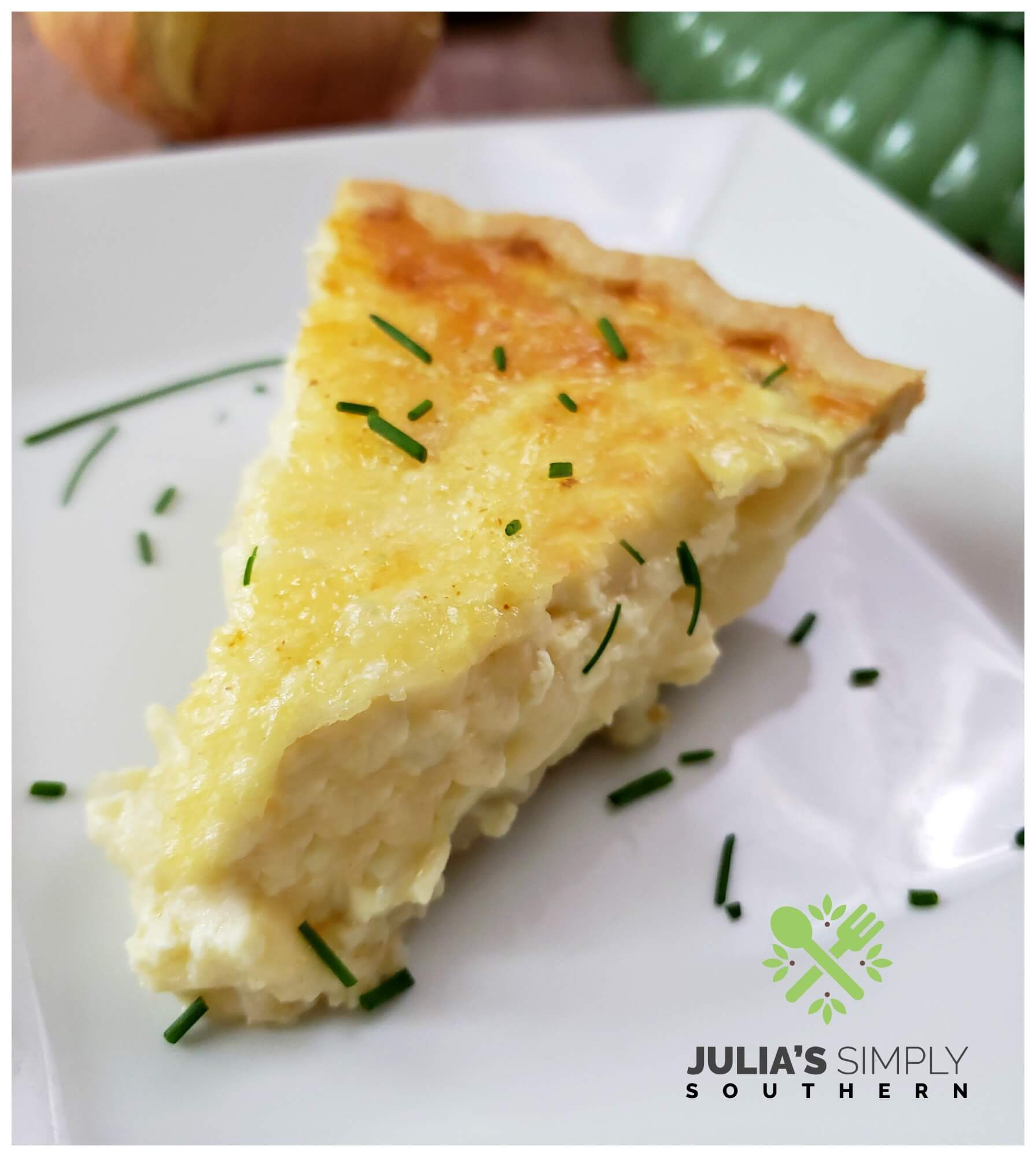 Creamy onion pie (quiche) made with Vidalia onions from Georgia and Swiss cheese on a white square plate.