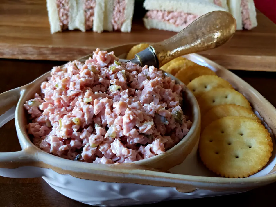 Serving bowl with sandwich spread made from bologna - bologna salad recipe. cup of the salad. cold water