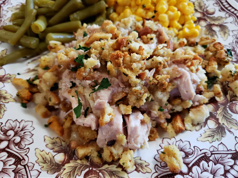 brown and white Thanksgiving china plate with turkey casserole with a crunchy topping