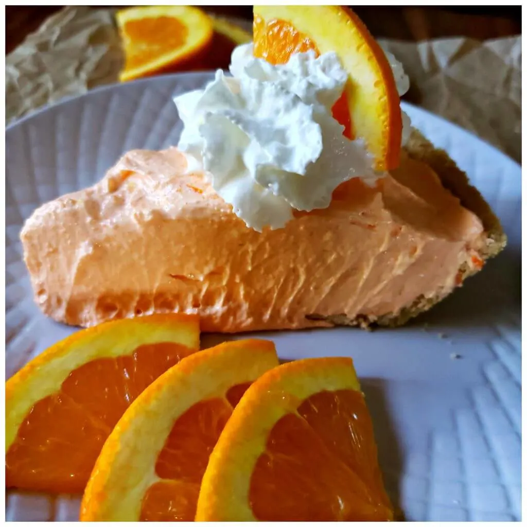 No bake orange chiffon pie recipe served on a white dessert plate