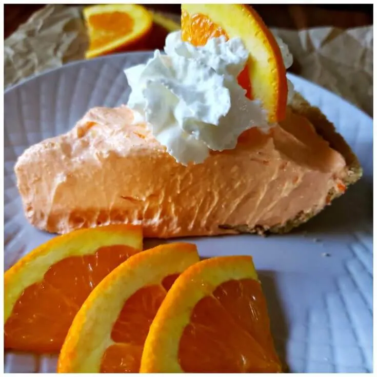 No bake orange chiffon pie recipe served on a white dessert plate