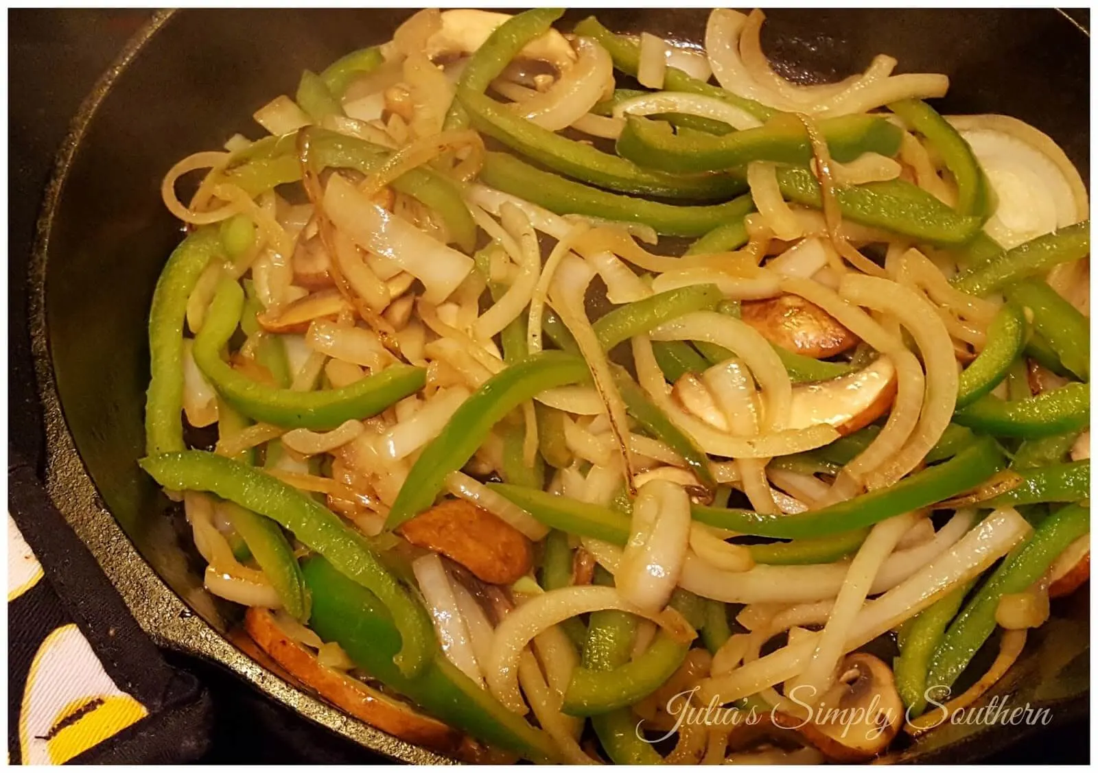 cooked peppers and onions with mushrooms