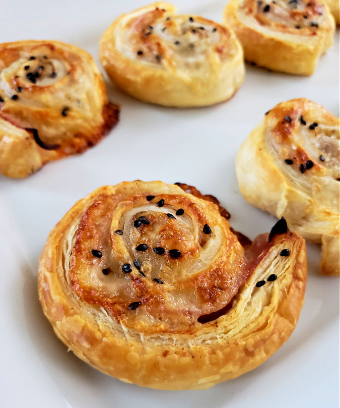 Ham and Cheese Pinwheels appetizers on a serving plate