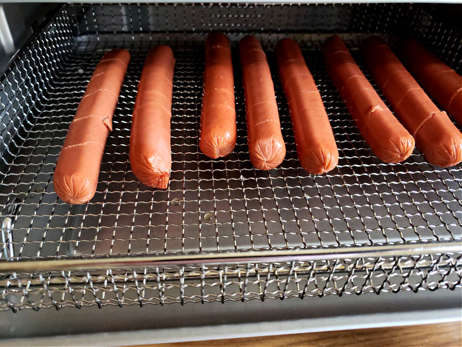 single layer of wieners in a rack for air fryer cooking