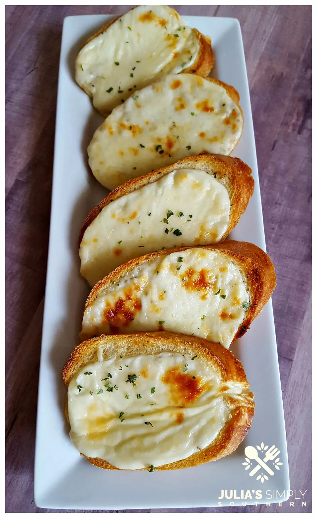 White platter with garlic cheese toast 