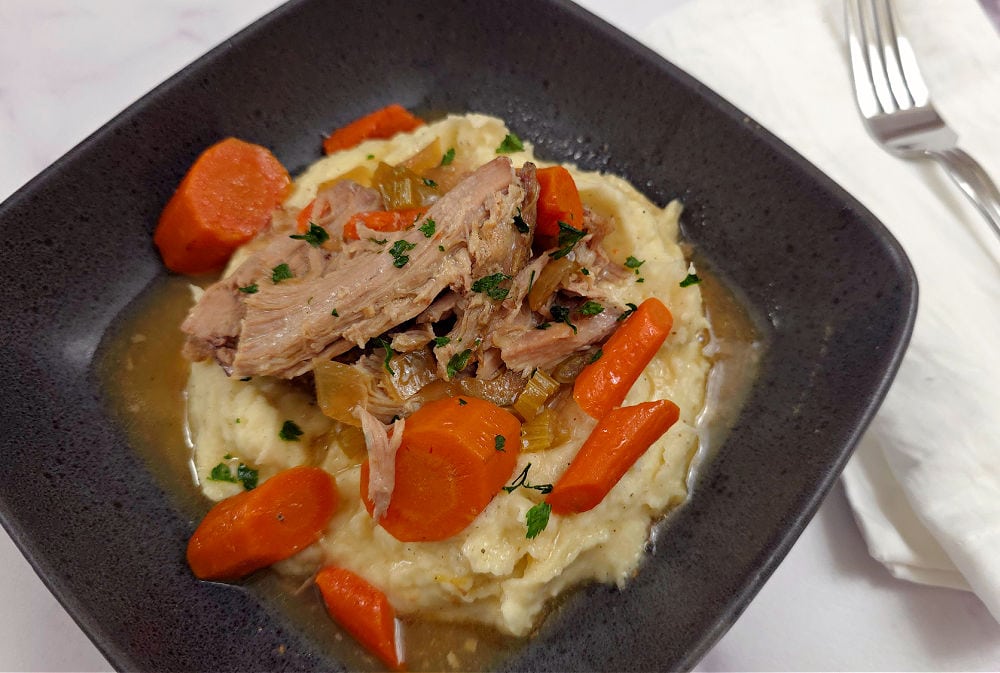 Delicious slow cooker pork butt roast with carrots