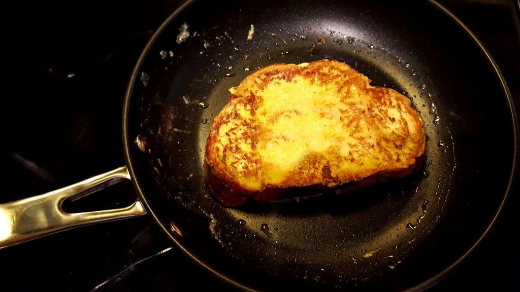 French toast cooking in a small skillet
