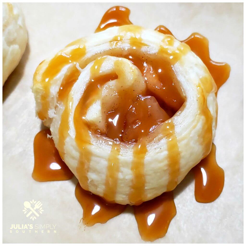 Apple and puff pastry roll ups drizzled with caramel sundae sauce