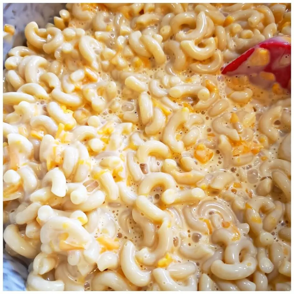 Combine cheesy pasta with cheese, milk and egg slurry