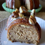 Butter Pecan Pound Cake with Praline Glaze on a white plate