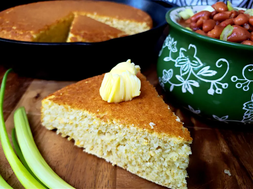 slice of southern cornbread with butter on top