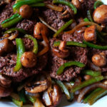 Hamburger Steak Recipe topped with sautéed onion, bell peppers and mushrooms - no gravy