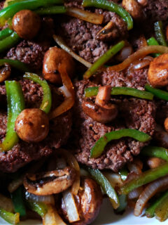 Hamburger Steak Recipe topped with sautéed onion, bell peppers and mushrooms - no gravy