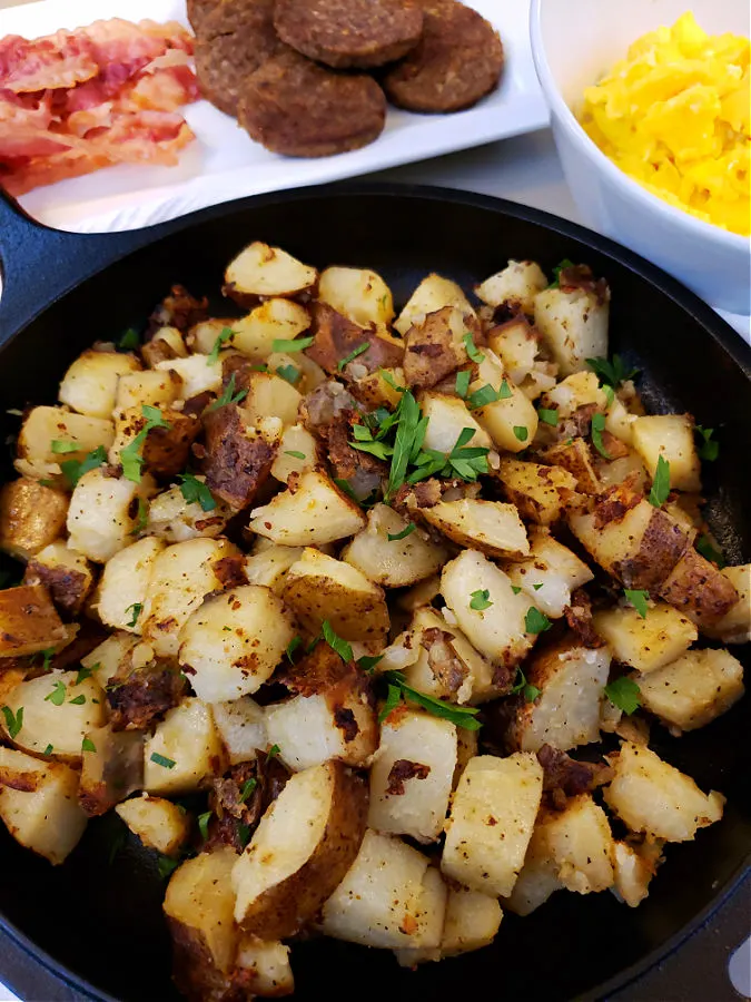Crispy Southern pan fried potatoes in a Lodge cast iron skillet