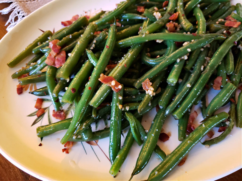 holiday sauteed green beans on a serving plate