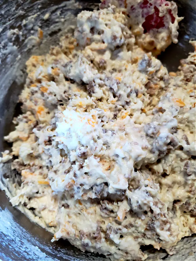 sausage cheese bread dough in a mixing bowl