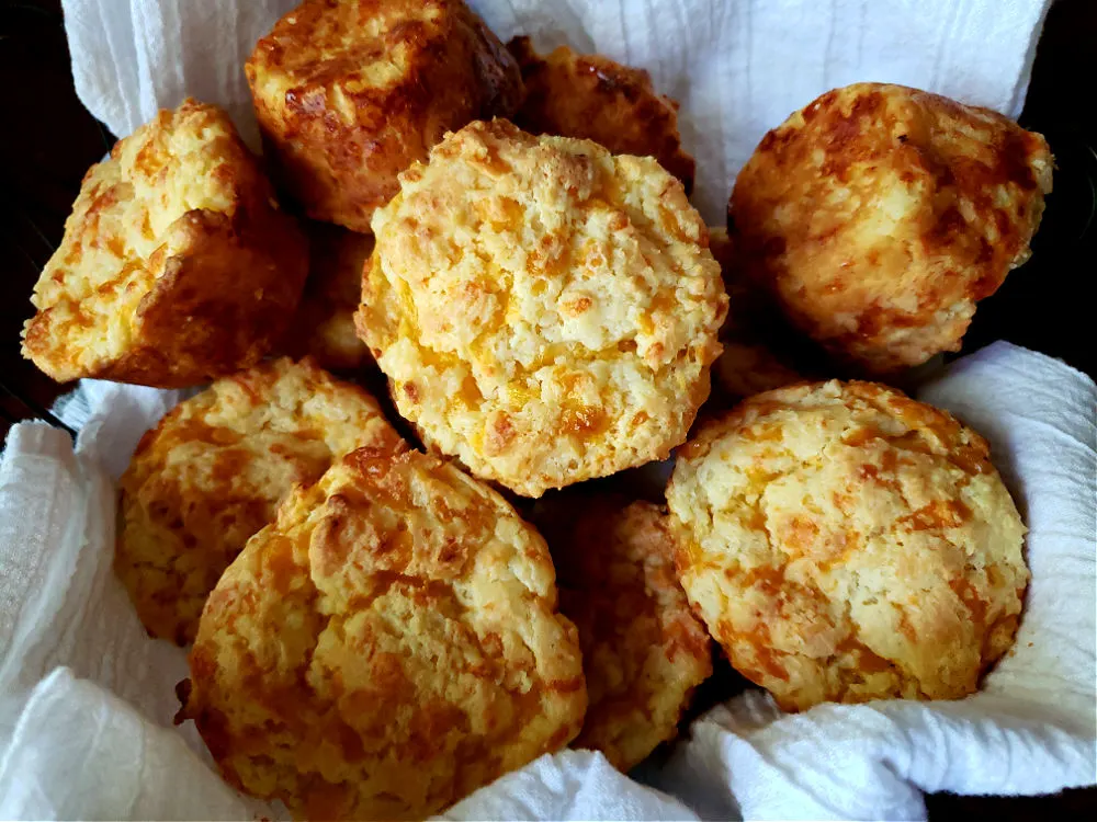 Easy Sour Cream Cheese Biscuits fresh from the oven in a bread basket