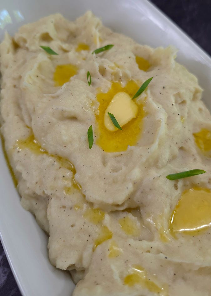 creamy mashed potatoes in a white bowl