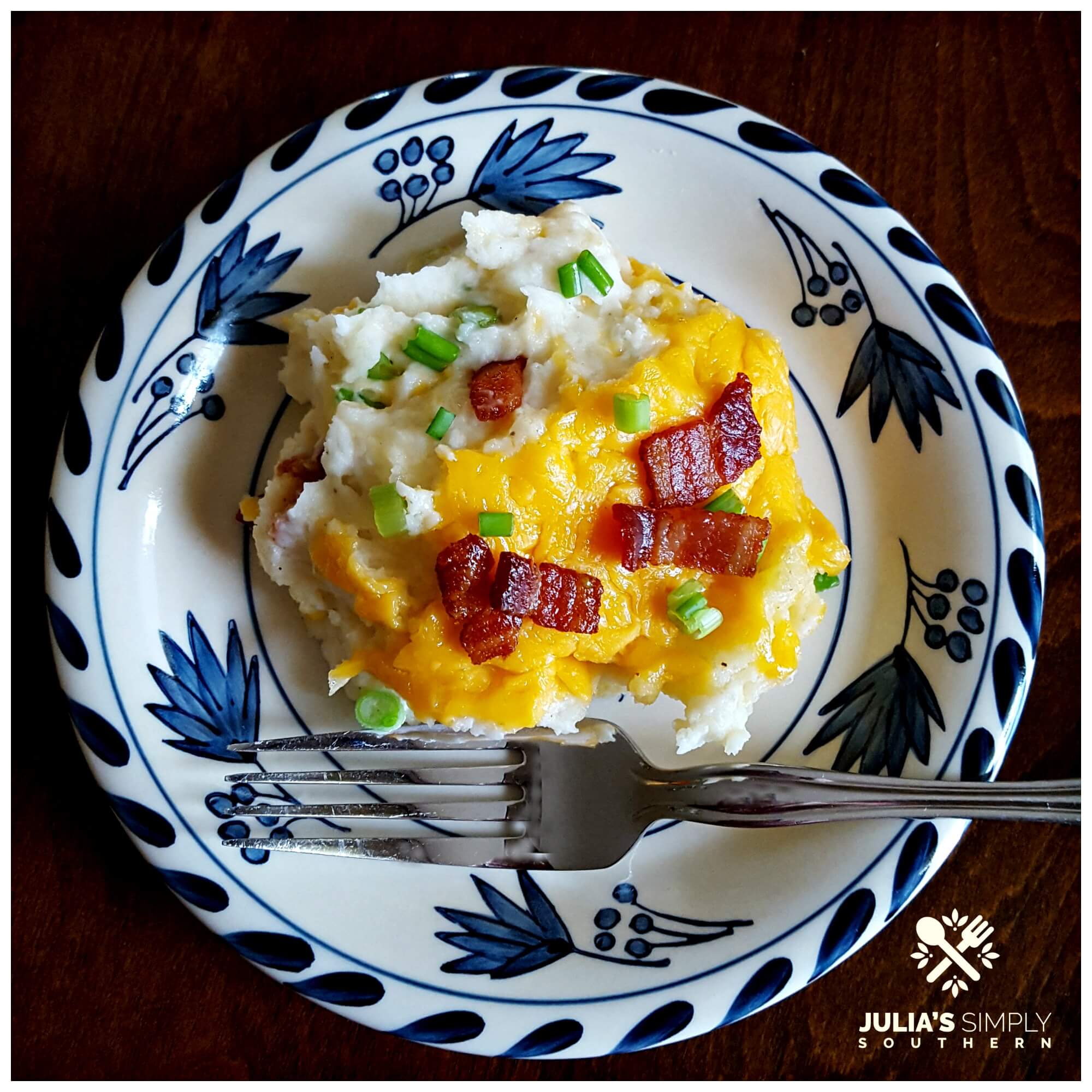 Potato casserole with cheese on a blue and white South Carolina china plate