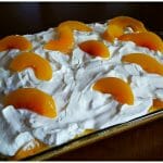 Peaches and Cream Poke Cake Dessert