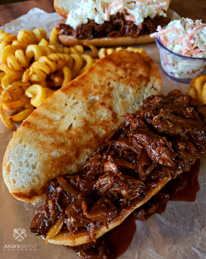 Easy Crock Pot BBQ Beef Sandwiches with fries and coleslaw are great for large crowds