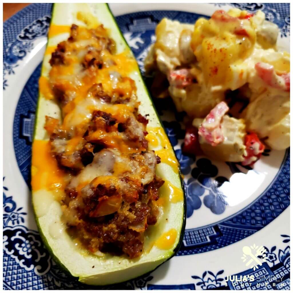 Delicious stuffed zucchini on a plate with potato salad