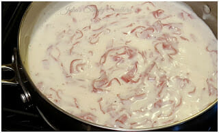 Simmering Creamed Chipped Beef in a skillet