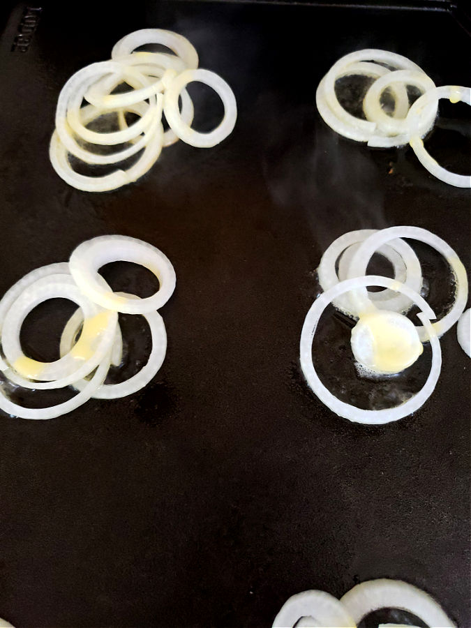 cook onions on griddle prior to adding burgers