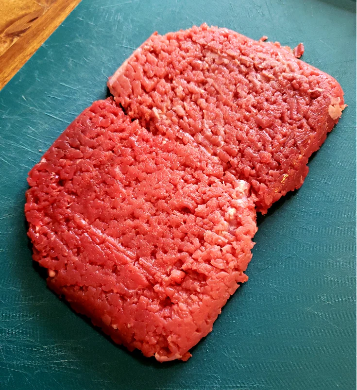 Cubed Steaks - tenderized beef on a cutting board